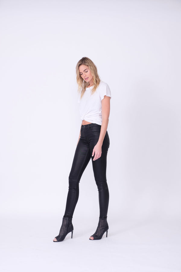Side View of Midheaven's High-Rise Black Coated Skinny   ITEM RUNS SMALL - CONSIDER SIZING UP ONE SIZE  Details: Model is 6’ and is wearing 3" heels.  Rise: 9.5"  Inseam: 30” or 34" (Please Choose Inseam Below)  Leg opening: 10”  Fabric Contents:  98% Cotton - 2% Elastane