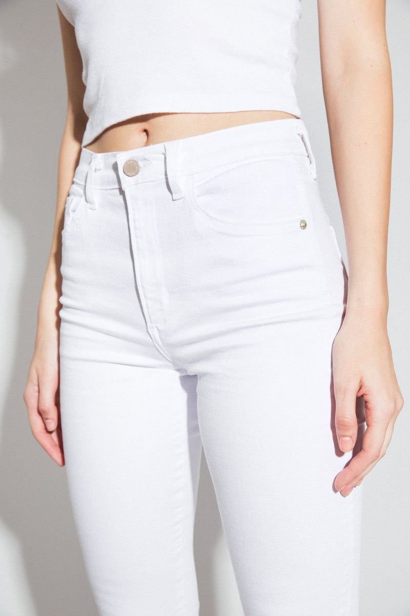 Front View Up Close of Midheaven's Mid-Rise White Skinny w/ Raw Hem     Details: Model is 5'10" and is wearing 4" heels. Rise: 9.75” Inseam: 29” Leg Opening: 10” Fabric contents: 98% Cotton - 2% Elastane