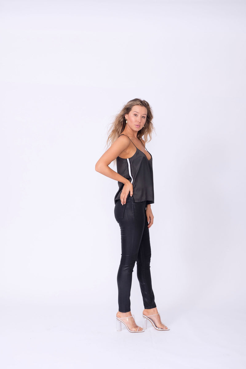 Side View of Midheaven's High-Rise Black Coated Skinny   ITEM RUNS SMALL - CONSIDER SIZING UP ONE SIZE  Details: Model is 5’7" and is wearing 3" heels.  Rise: 9.5"  Inseam: 30” or 34" (Please Choose Inseam Below)  Leg opening: 10”  Fabric Contents:  98% Cotton - 2% Elastane