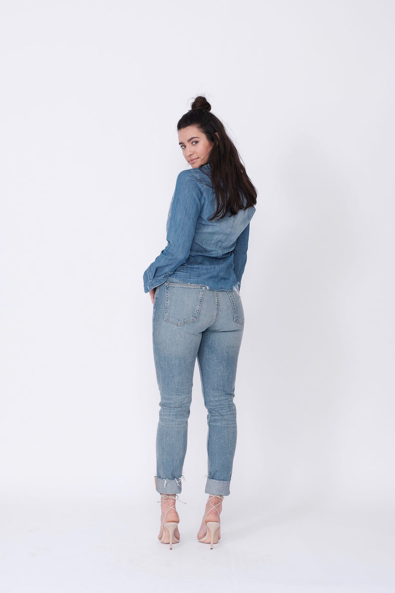 Back View of Midheaven's High-Rise Vintage Wash Button Fly Skinny w/ Raw Hem    Details: Model is 5' 9" and is wearing 4" heels. Rise: 10 3/4” Inseam: 28” Leg Opening: 10.5” Fabric contents: 98% Cotton - 2% Elastane