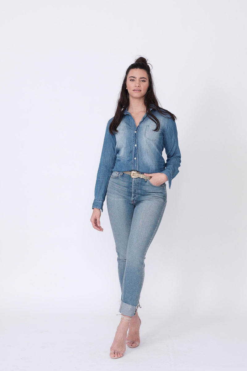 Front View of Midheaven's High-Rise Vintage Wash Button Fly Skinny w/ Raw Hem    Details: Model is 5' 9" and is wearing 4" heels. Rise: 10 3/4” Inseam: 28” Leg Opening: 10.5” Fabric contents: 98% Cotton - 2% Elastane