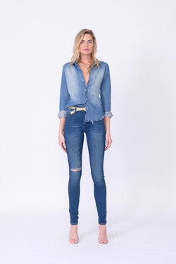 Front View of Midheaven's High-Rise Indigo Skinny    Details: Model is 6’ and is wearing 4" heels. Rise: 10” Inseam: 35.5” Leg Opening: 9.5” Fabric contents: 98%Cotton - 2%Elastane