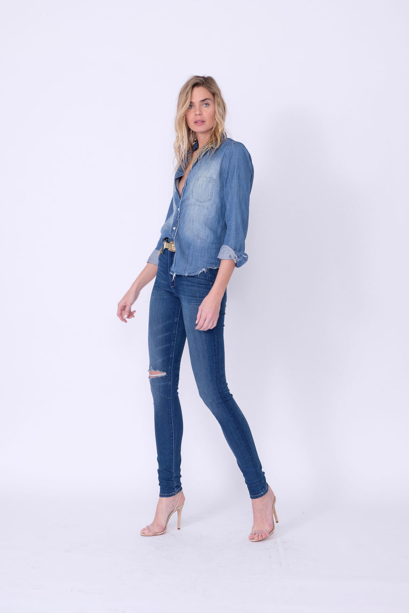 Side View of Midheaven's High-Rise Indigo Skinny    Details: Model is 6’ and is wearing 4" heels. Rise: 10” Inseam: 35.5” Leg Opening: 9.5” Fabric contents: 98%Cotton - 2%Elastane