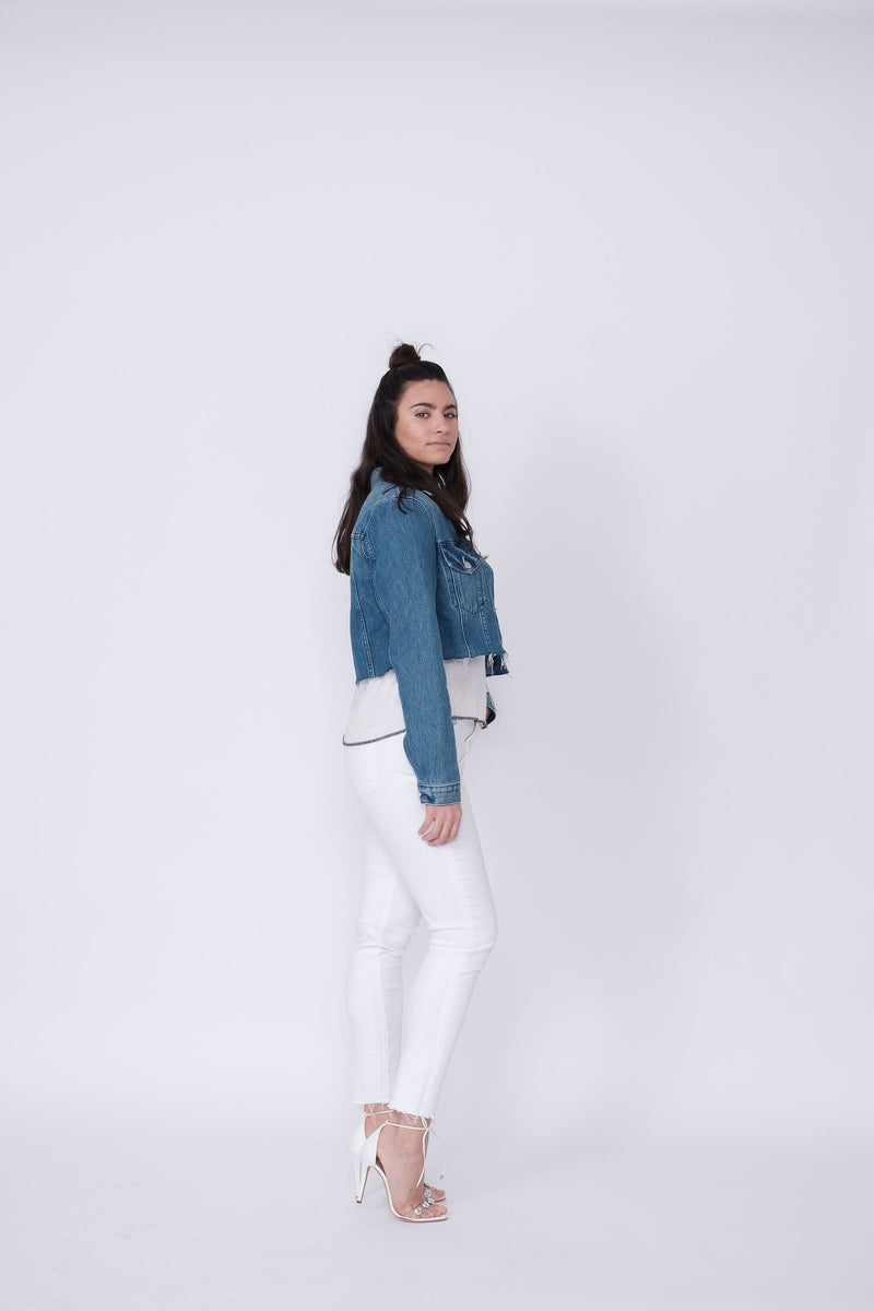 Side View of Midheaven's Cropped Denim Jacket in Indigo  Details: Fabric contents 100% Cotton