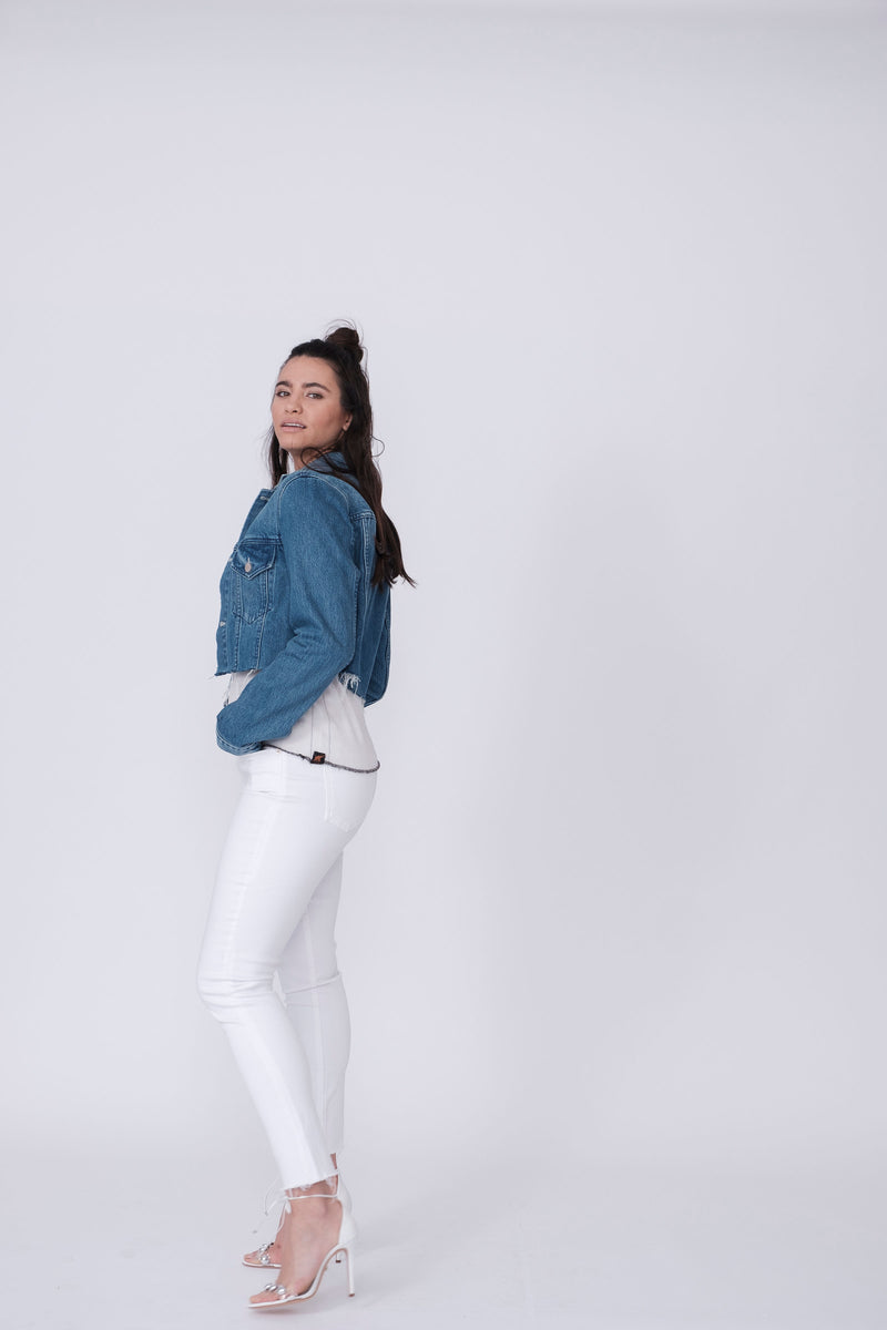 Side View of Midheaven's Cropped Denim Jacket in Indigo  Details: Fabric contents 100% Cotton