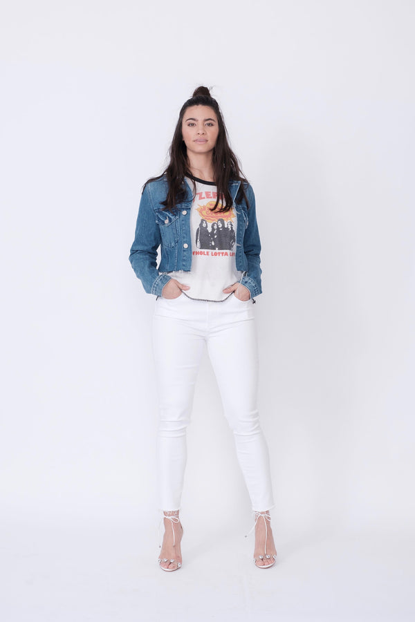Front View of Midheaven's Mid-Rise White Skinny w/ Raw Hem     Details: Model is 5'10" and is wearing 4" heels. Rise: 9.75” Inseam: 29” Leg Opening: 10” Fabric contents: 98% Cotton - 2% Elastane