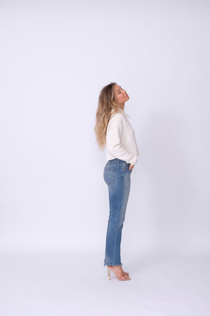 Side View of Midheaven's Relaxed High-Rise Straight Leg Details: First Model: 5' 7" - Wearing 4" Heels Rigid denim will relax with wear. Considering going down one size.  Rise: 10" Inseam: 30" Leg opening: 14” Fabric Contents:  98% Cotton - 2% Elastane